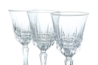 Photo of Three empty clean glasses isolated on white