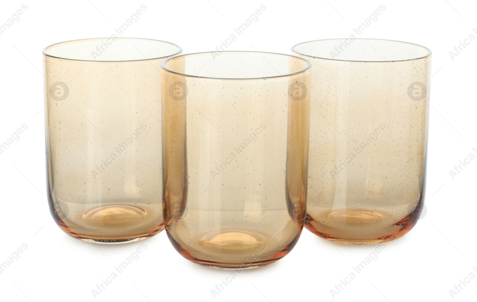 Photo of Three empty clean glasses isolated on white