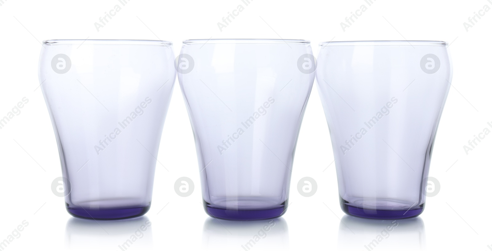 Photo of Three empty clean glasses isolated on white