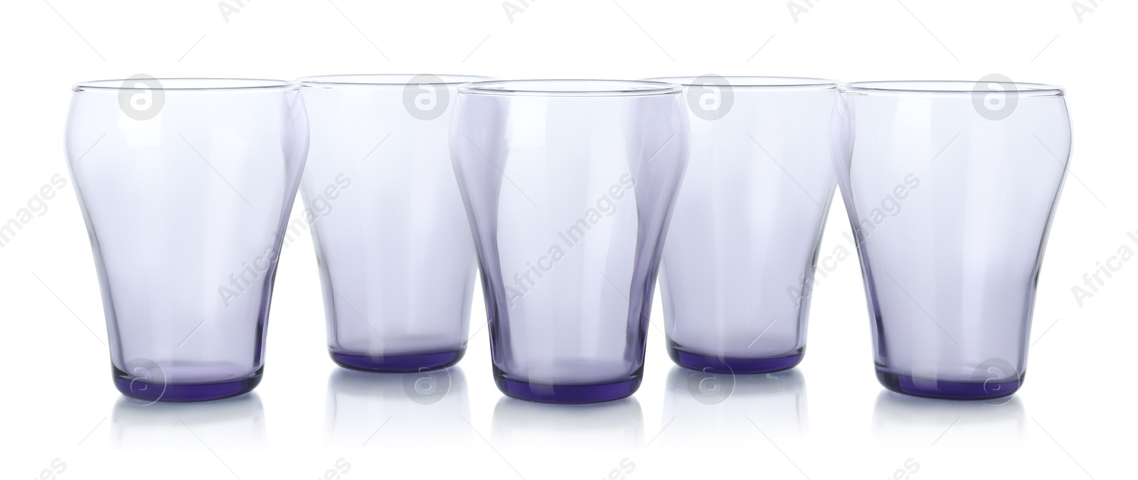 Photo of Many empty clean glasses isolated on white