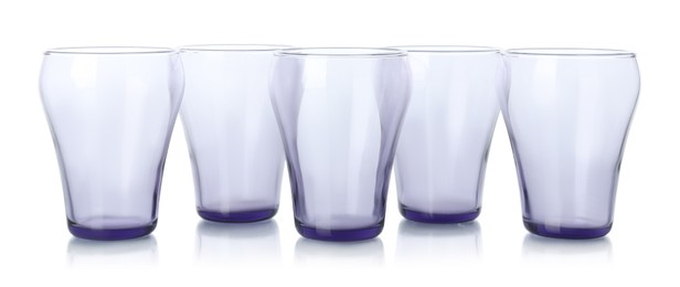 Photo of Many empty clean glasses isolated on white