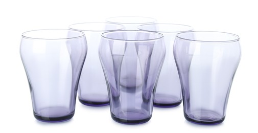 Photo of Many empty clean glasses isolated on white