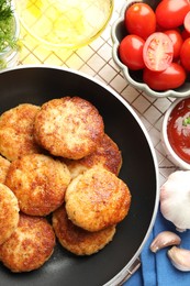 Photo of Delicious patties, spices and tomatoes on table, flat lay