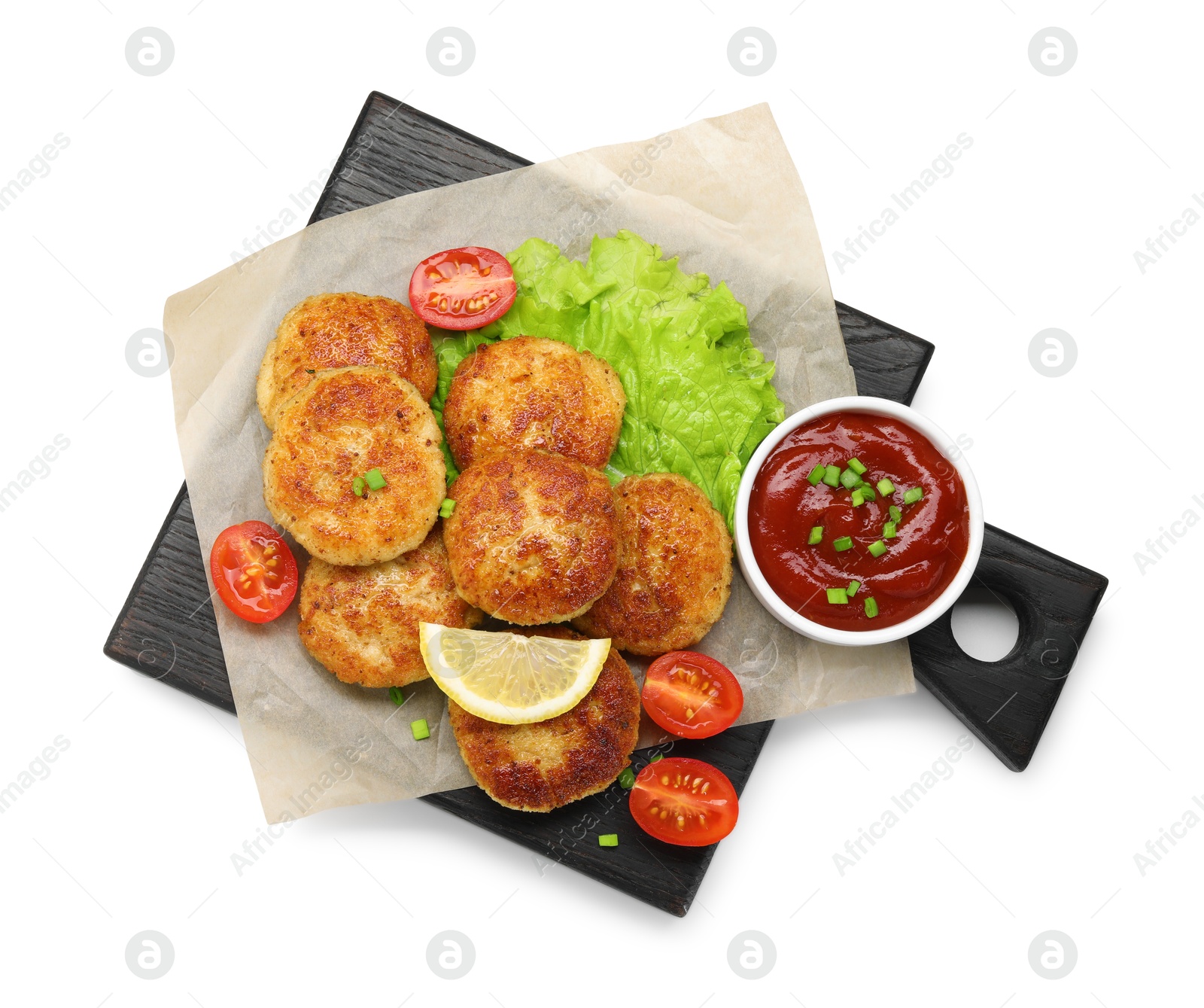 Photo of Delicious patties with green onions, tomatoes and ketchup isolated on white, top view