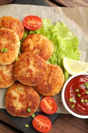 Photo of Delicious patties served on wooden table, top view