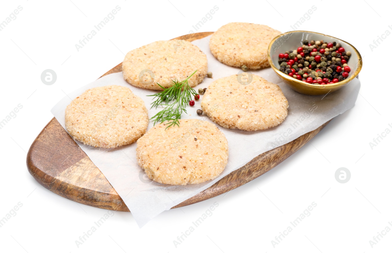 Photo of Many uncooked patties and spices isolated on white