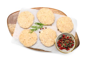 Photo of Many uncooked patties and spices isolated on white, top view