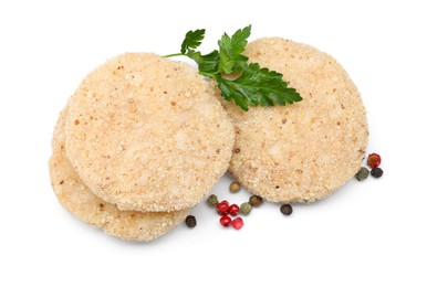 Photo of Uncooked patties and spices isolated on white, top view