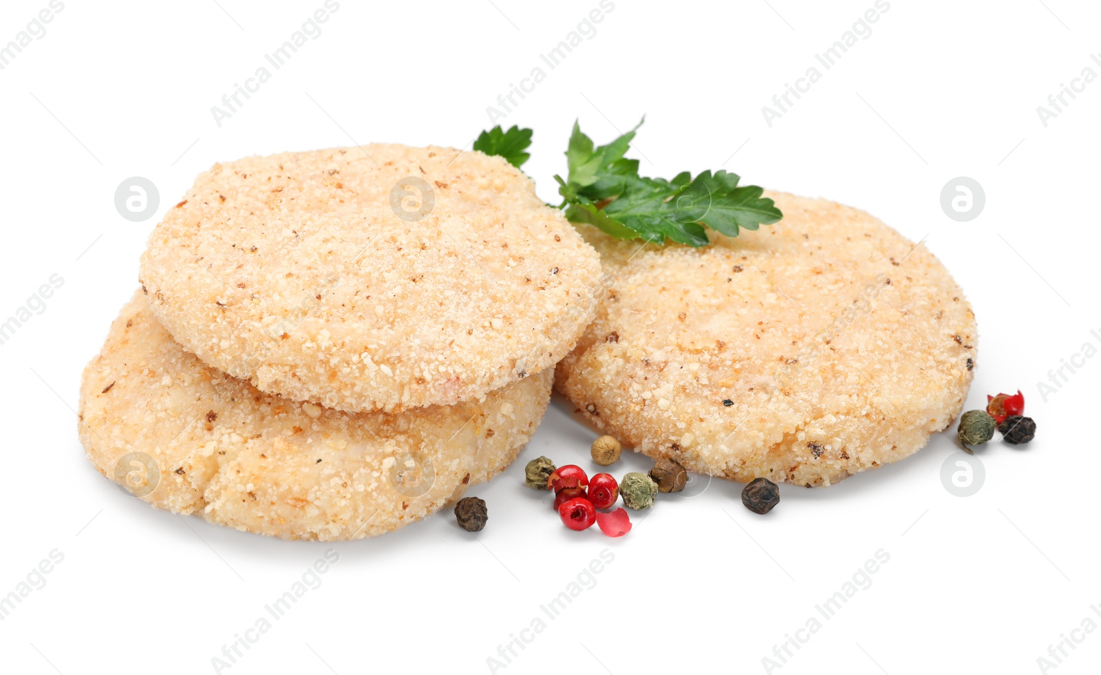 Photo of Uncooked patties and spices isolated on white