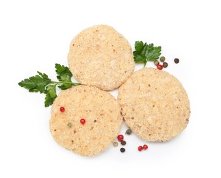 Photo of Uncooked patties and spices isolated on white, top view