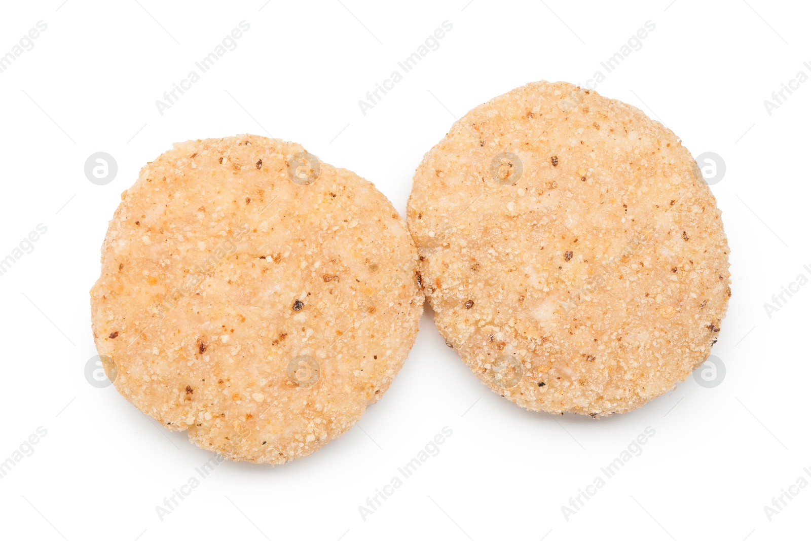 Photo of Two uncooked fresh patties isolated on white, top view