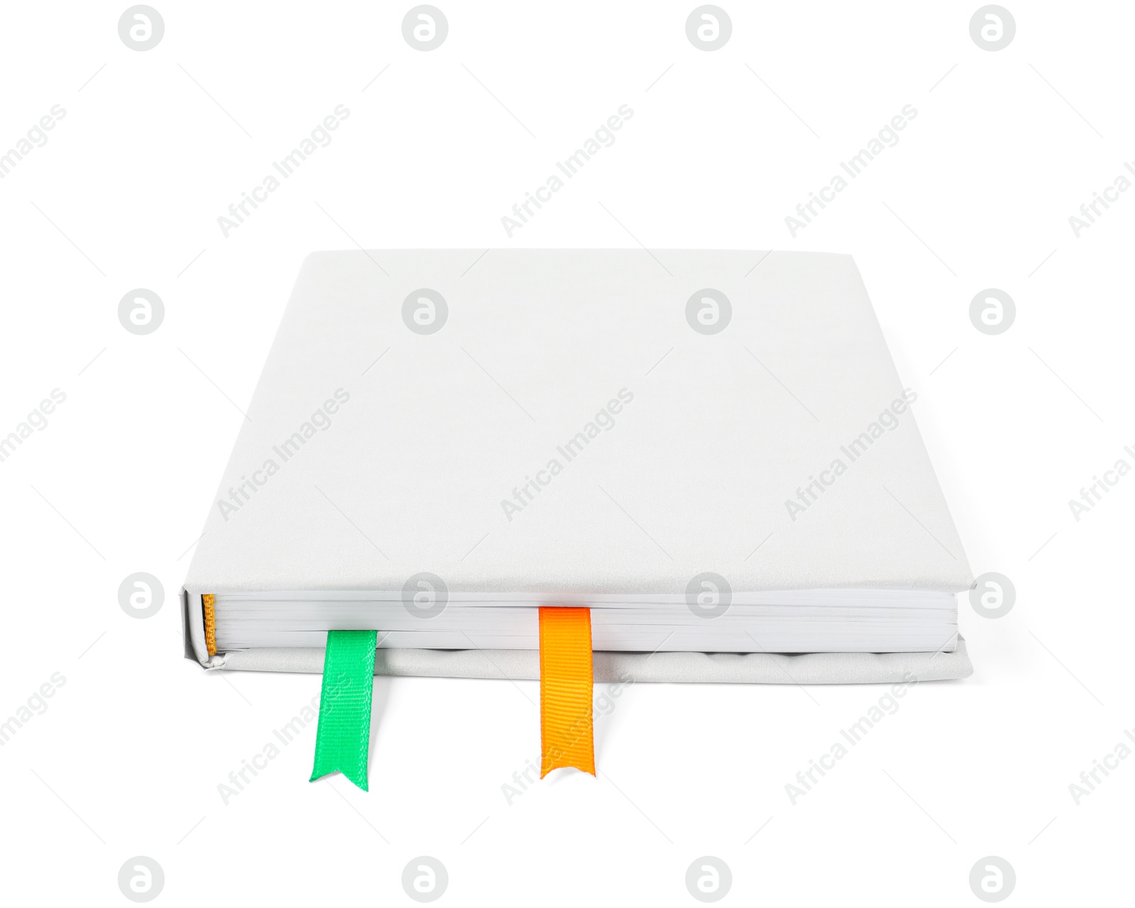 Photo of Book with ribbon bookmarks isolated on white