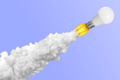 Image of Light bulb flying like rocket with smoke and fire on light violet blue background. Concepts of idea, startup, creativity, fast success