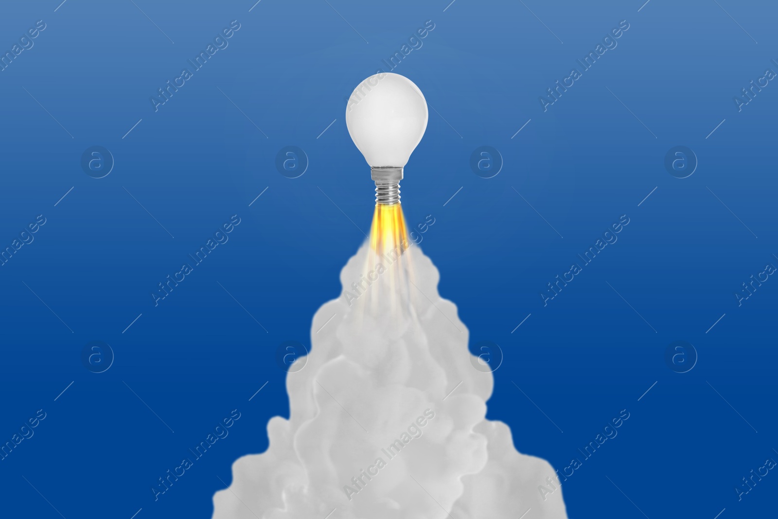 Image of Light bulb soaring up like rocket with smoke and fire on blue gradient background. Concepts of idea, startup, creativity, fast success