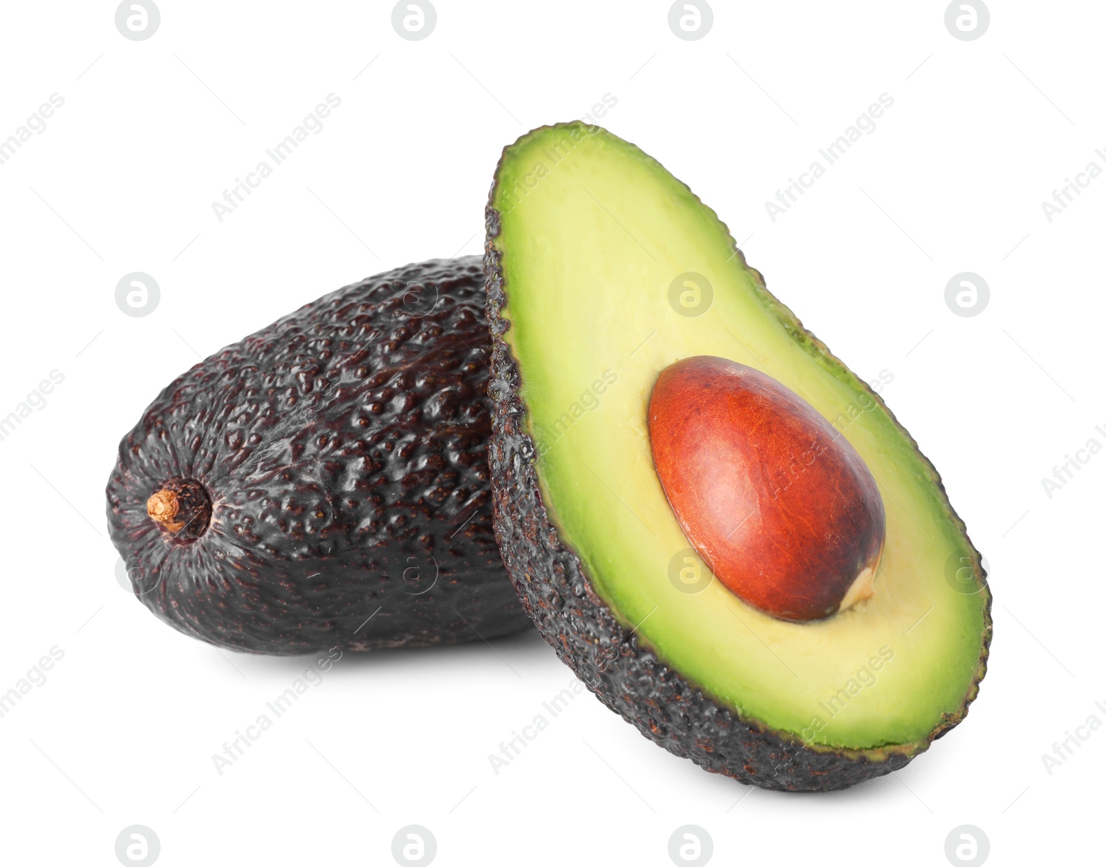 Photo of Whole and cut ripe avocados isolated on white