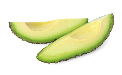 Photo of Slices of ripe avocado isolated on white