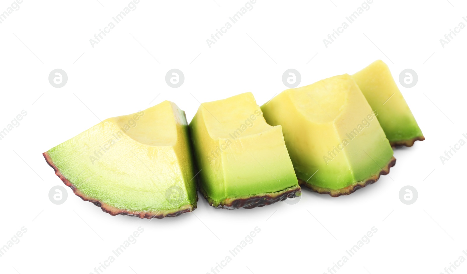 Photo of Slices of ripe avocado isolated on white