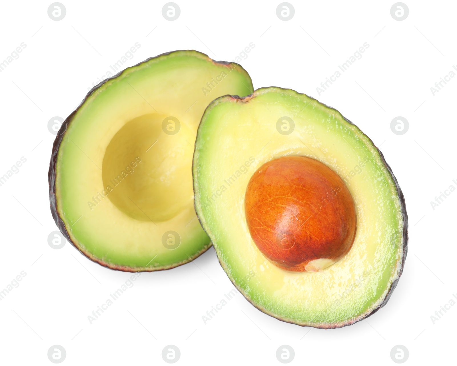 Photo of Halves of ripe avocado isolated on white