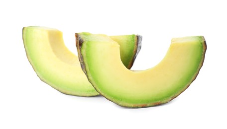 Photo of Slices of ripe avocado isolated on white