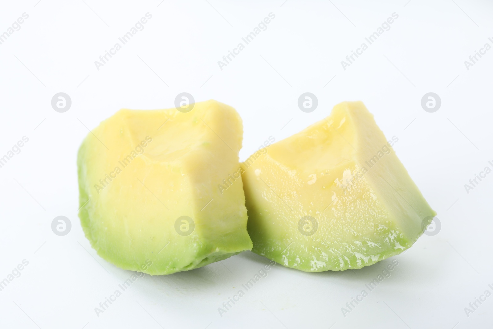 Photo of Slices of ripe avocado on white background