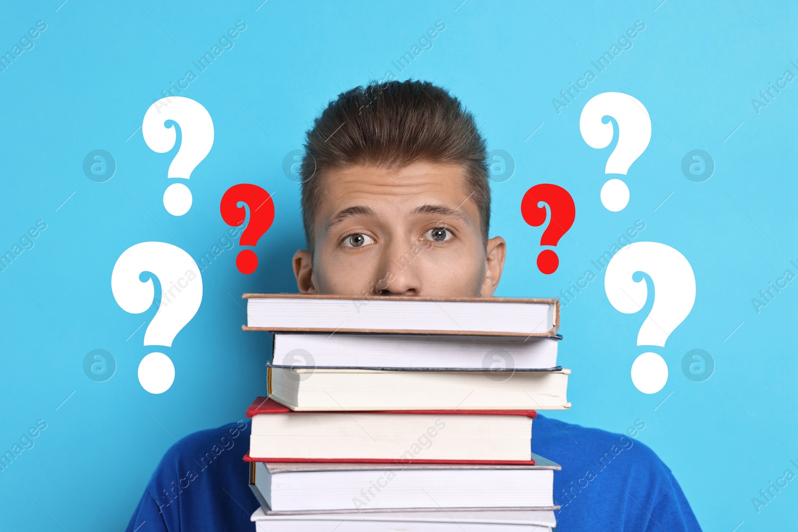 Image of Young man with books on light blue background. Question marks around him