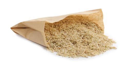 Photo of Raw brown rice in paper bag isolated on white