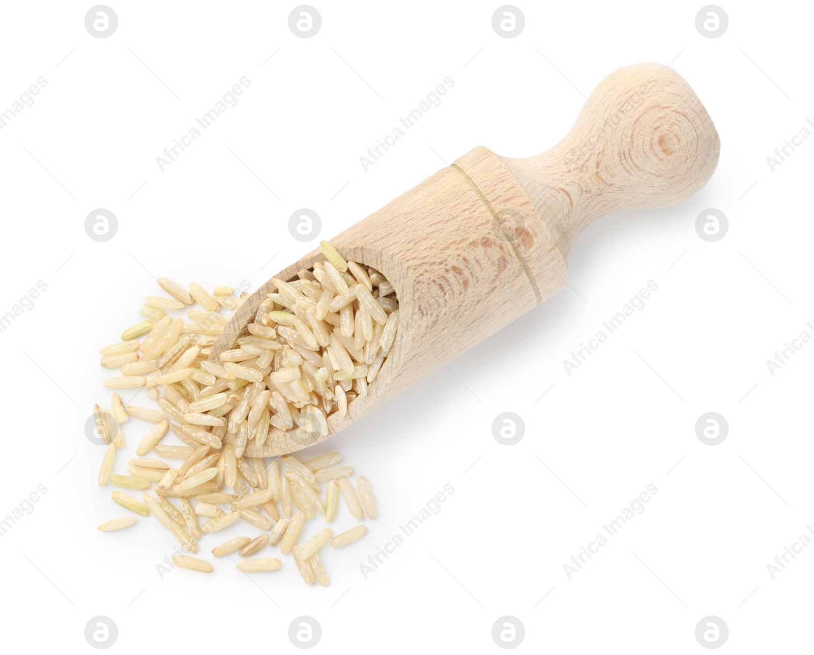 Photo of Raw brown rice and scoop isolated on white, top view