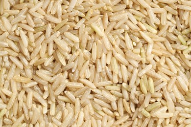 Photo of Pile of brown rice as background, top view