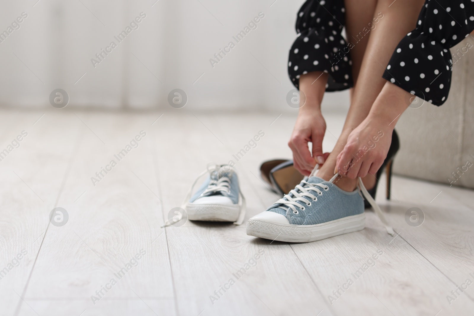 Photo of Woman changing shoes at home, closeup. Space for text