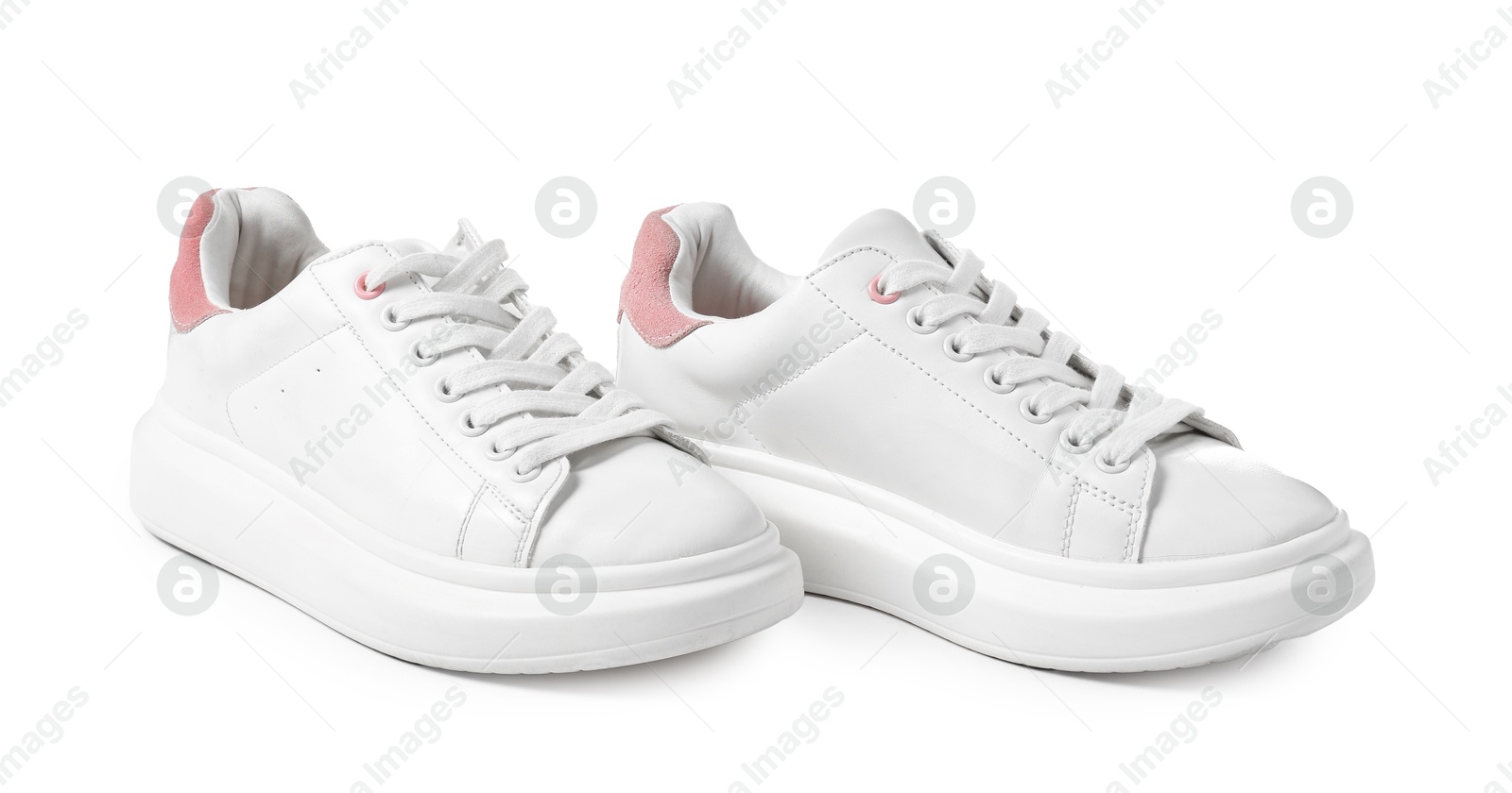 Photo of Pair of stylish sneakers isolated on white. Sportive shoes