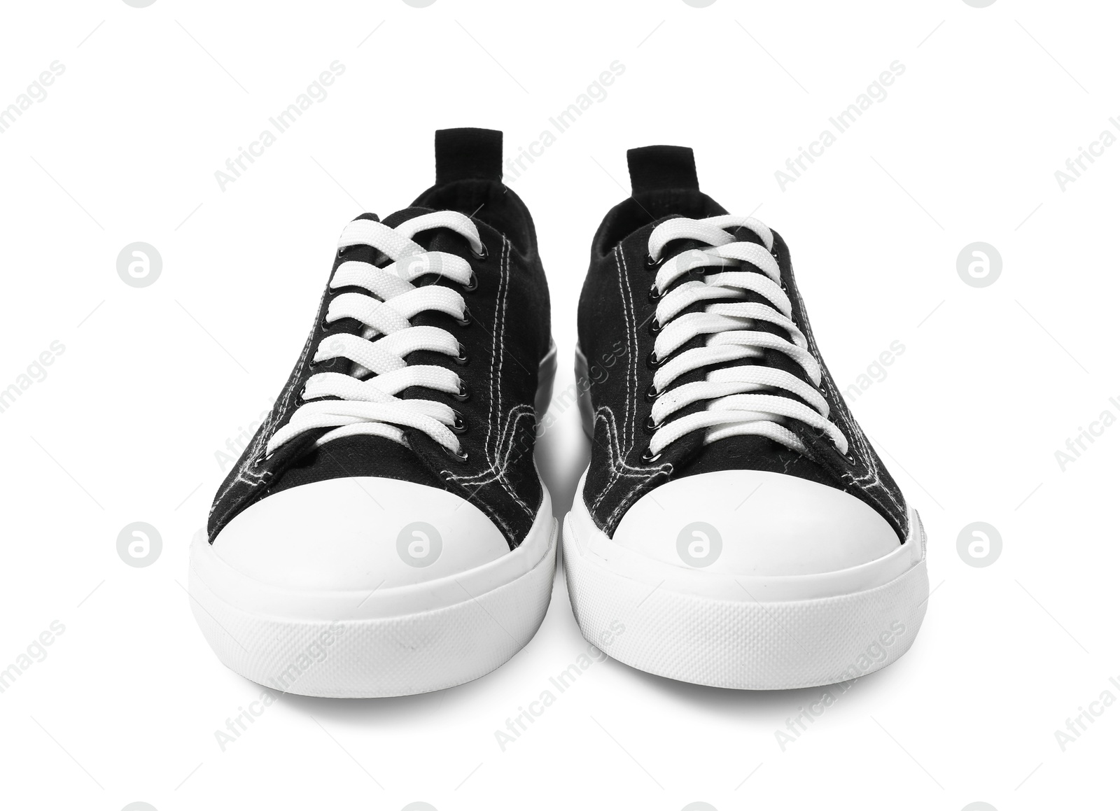 Photo of Pair of black sneakers isolated on white. Sportive shoes