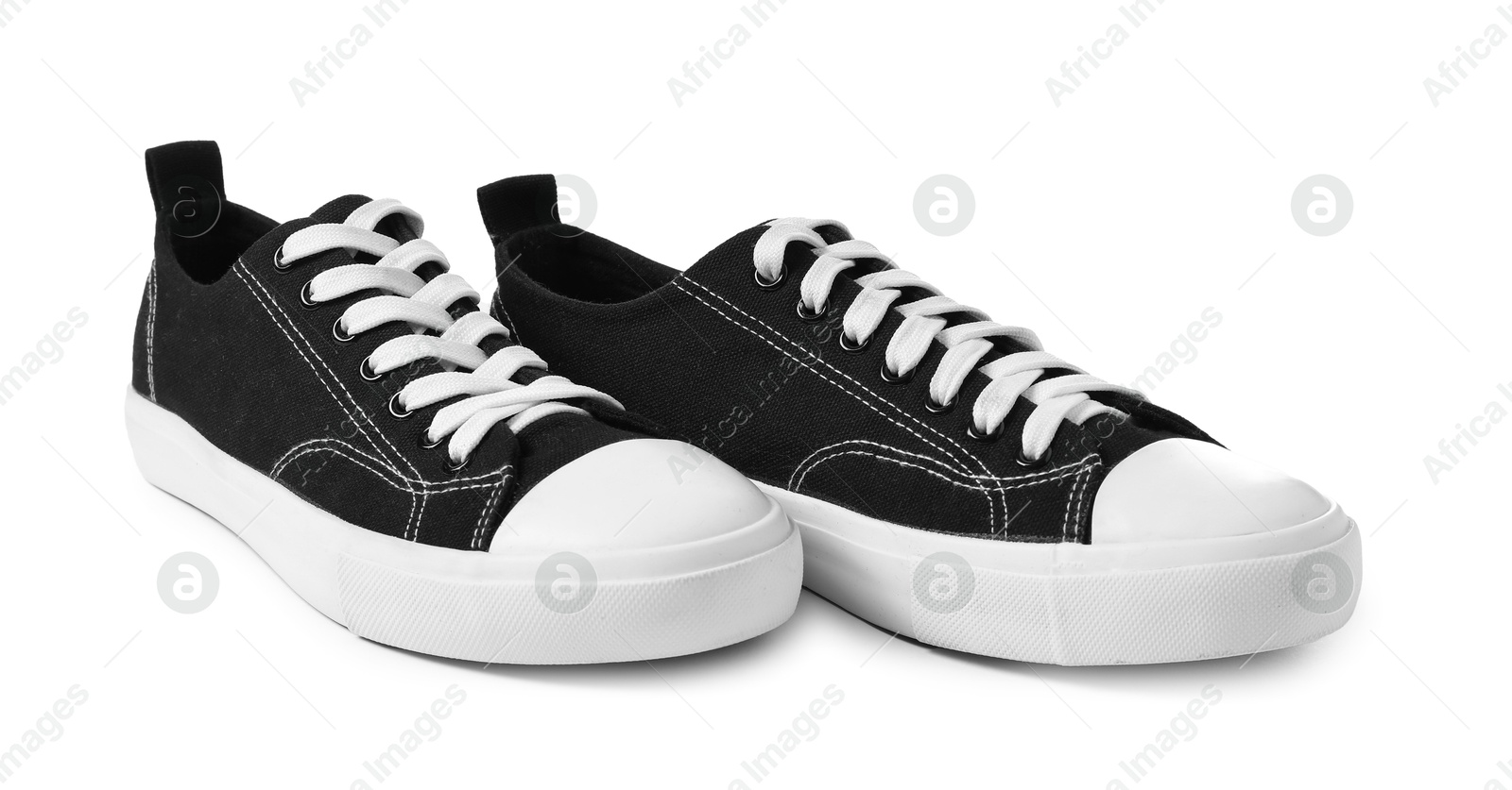 Photo of Pair of black sneakers isolated on white. Sportive shoes