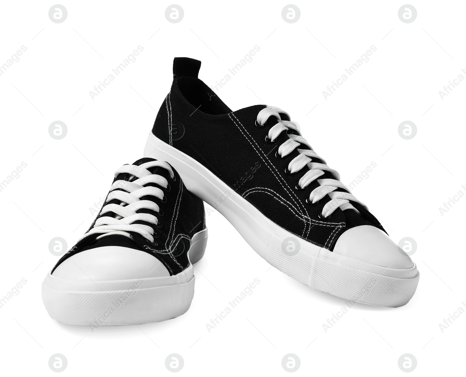 Photo of Pair of black sneakers isolated on white. Sportive shoes