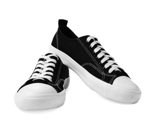 Photo of Pair of black sneakers isolated on white. Sportive shoes