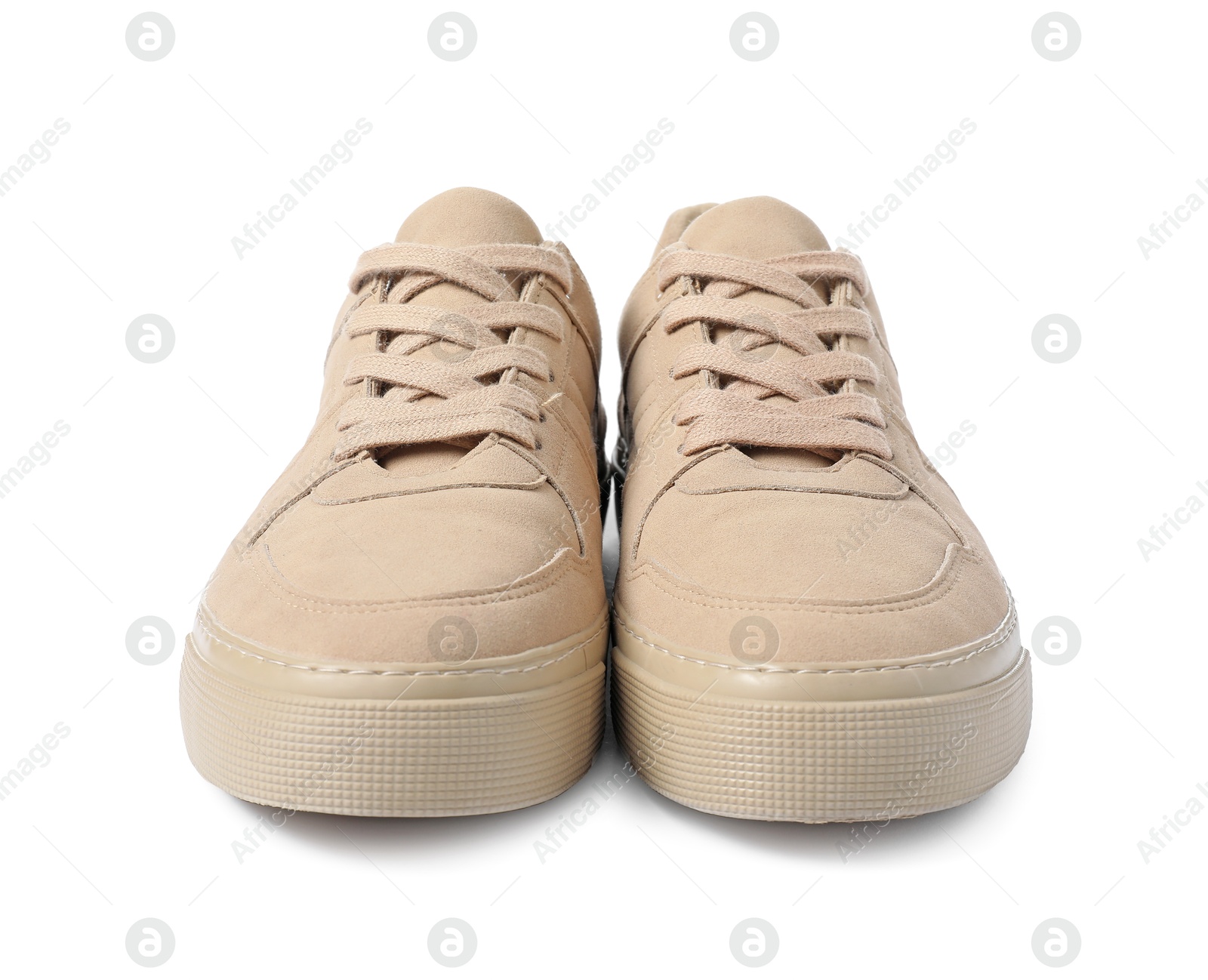 Photo of Pair of beige sneakers isolated on white. Sportive shoes