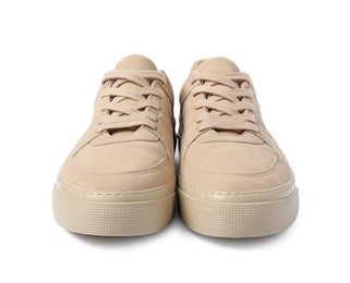 Photo of Pair of beige sneakers isolated on white. Sportive shoes