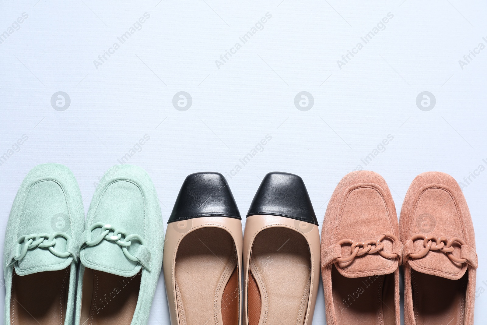 Photo of Different stylish shoes on white background, flat lay. Space for text