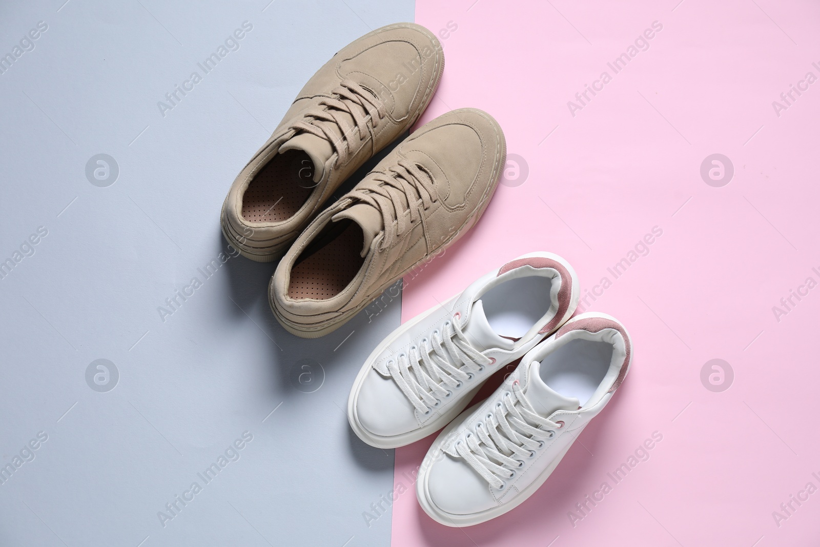 Photo of Different stylish sneakers on color background, flat lay. Sportive shoes