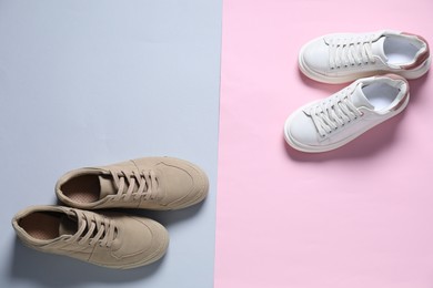 Photo of Sportive shoes. Different stylish sneakers on color background, flat lay. Space for text