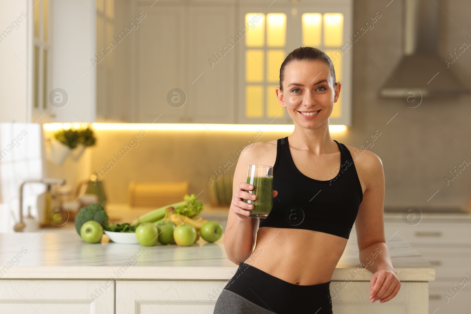 Photo of Weight loss. Happy woman with healthy shake in kitchen