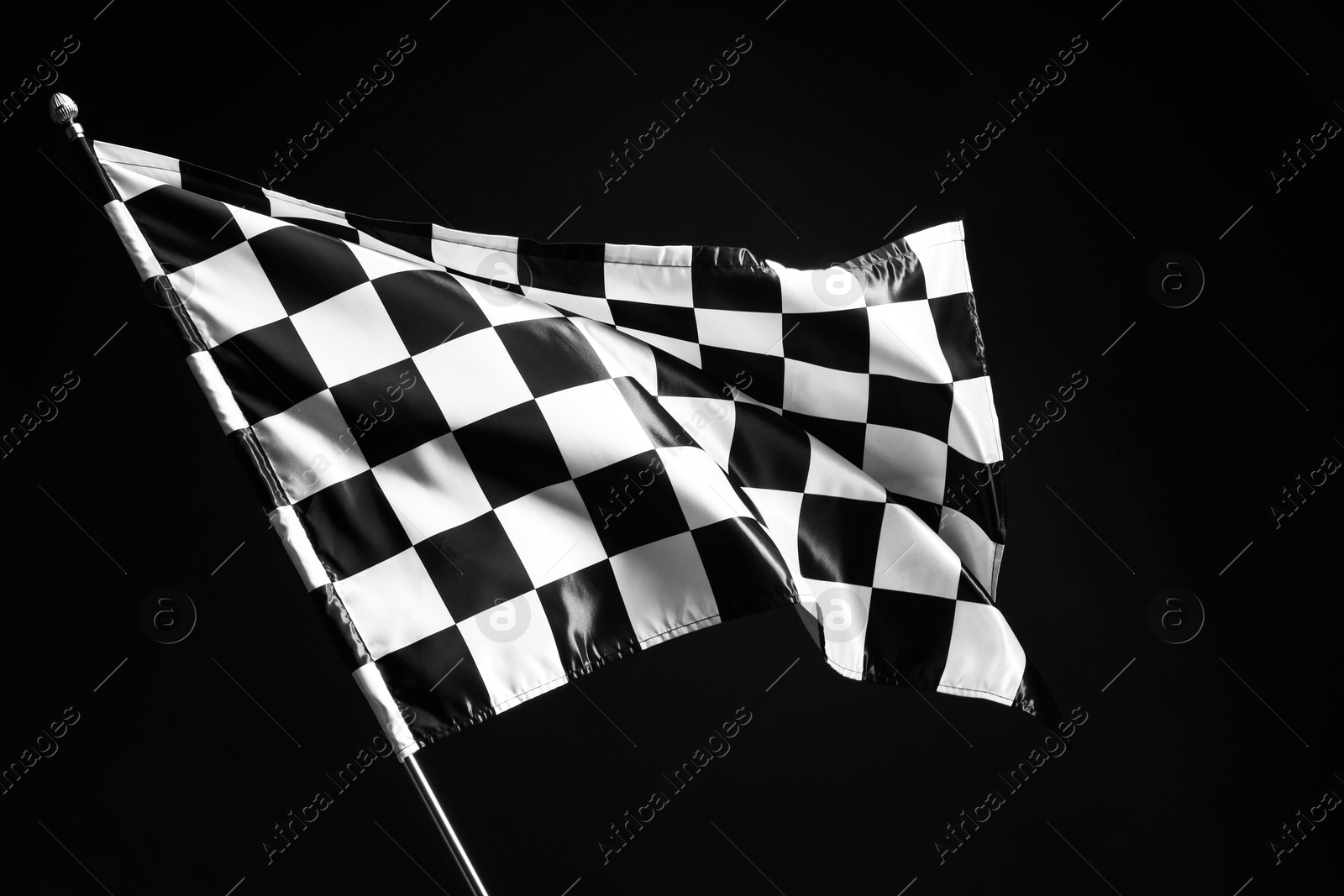 Photo of One racing checkered flag on black background