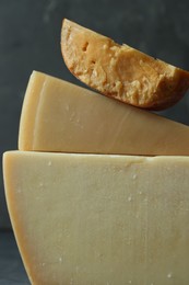 Photo of Different types of cheese on blurred background, closeup