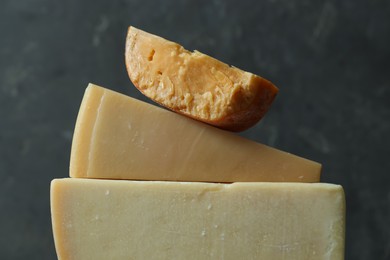 Photo of Different types of cheese on blurred background, closeup