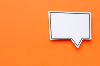 Photo of Blank speech bubble on orange background, top view. Space for text