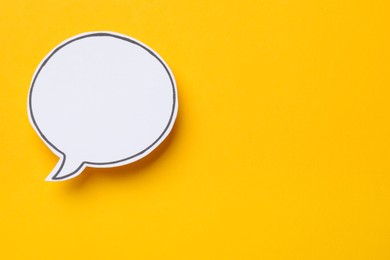 Photo of Blank speech bubble on yellow background. Space for text