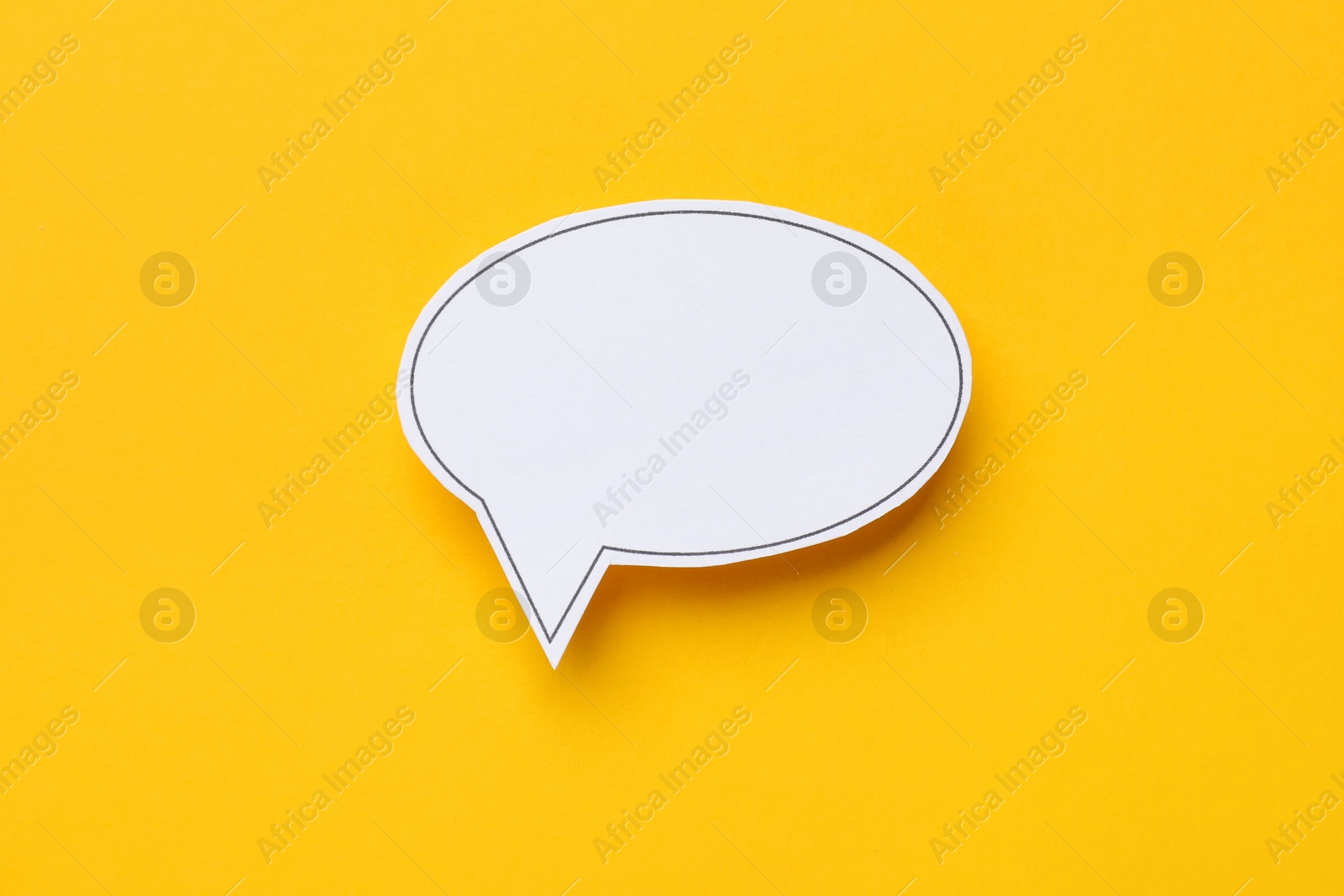 Photo of Blank speech bubble on yellow background. Space for text