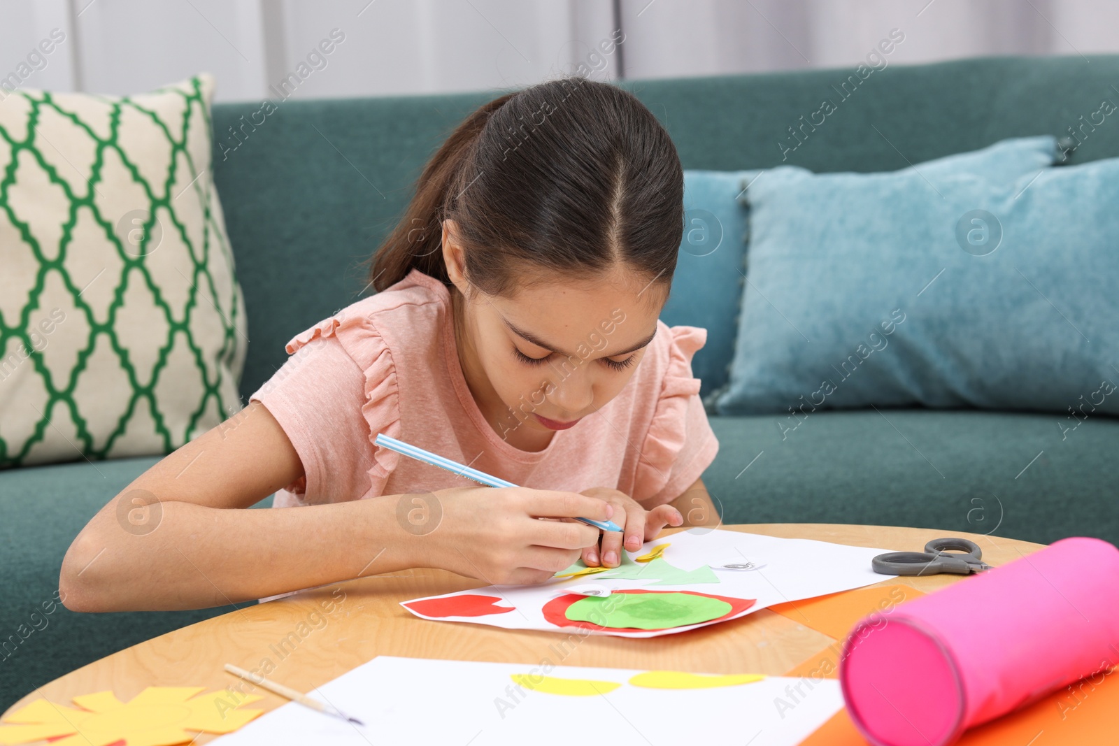 Photo of Girl drawing card at table indoors. Art and craft