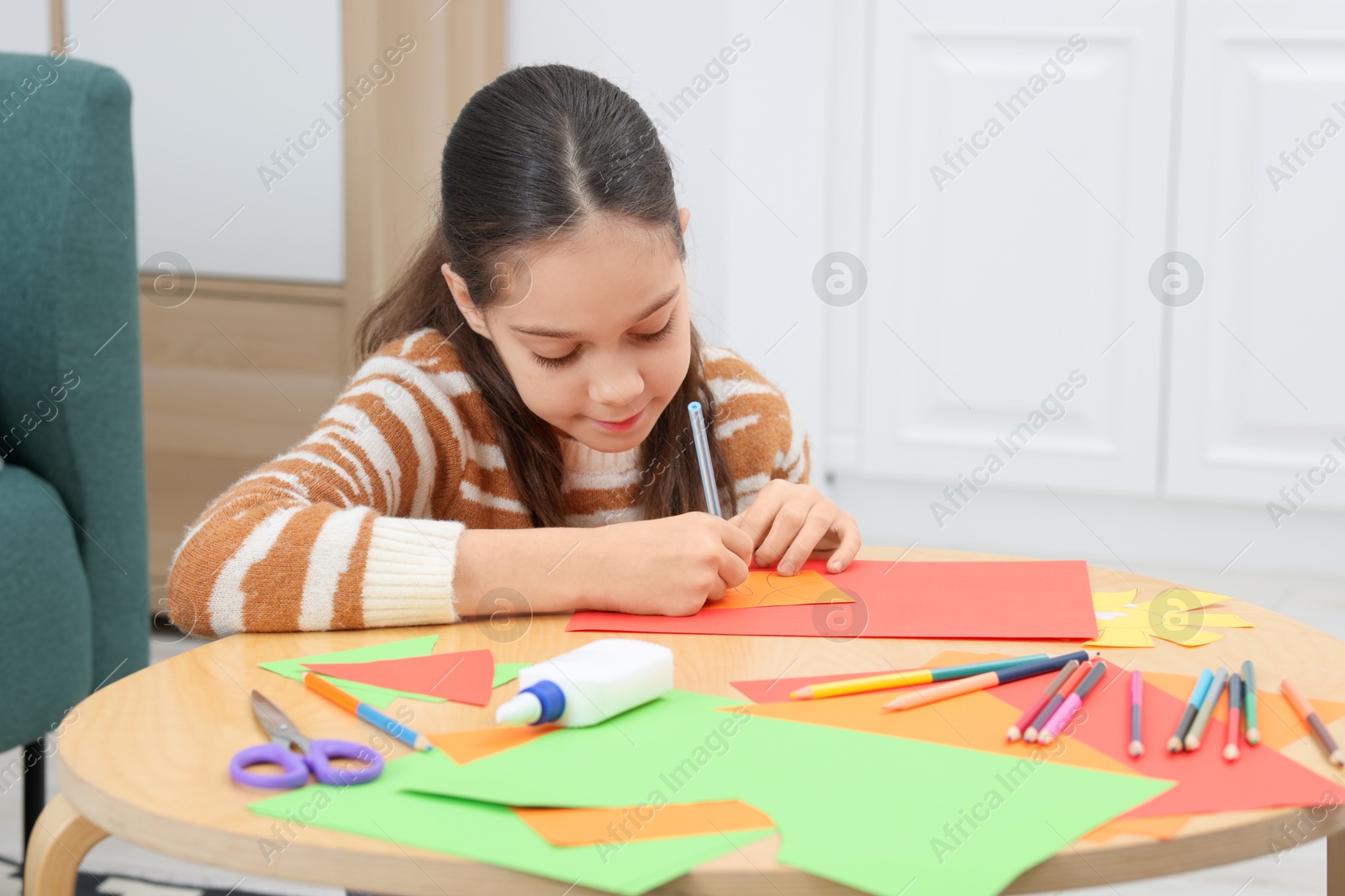 Photo of Girl drawing card at table indoors. Art and craft