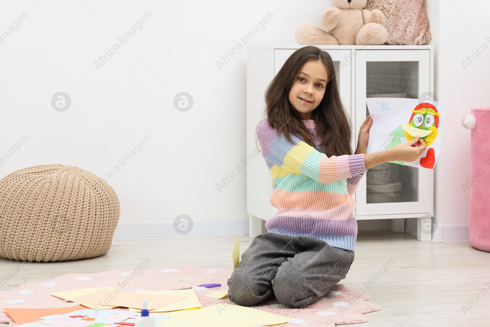 Photo of Girl showing her creative project at home, space for text. Art and craft