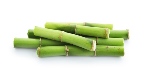 Photo of Cut green bamboo stems isolated on white